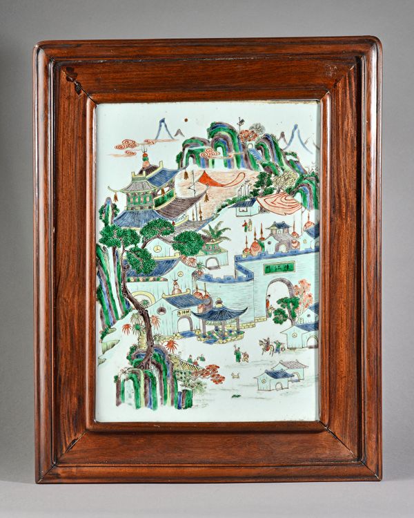 A Chinese famille- verte rectangular plaque, 19th century, painted with city walls, pavilions, figures, trees and mountains, painted black characters