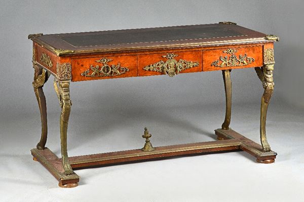 A pair of walnut and gilt metal mounted bureau plats, late 20th century in the Empire manner, each with leather inset top above three frieze drawers a