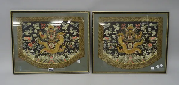 A pair of Chinese embroidered dragon panels, 19th century, each gilt front-facing dragon surrounded by clouds and emblems above waves, image 27cm. by