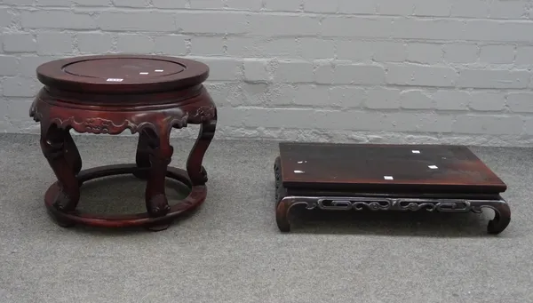 A Chinese hardwood circular stand, 20th century, carved with bats above five cabriole legs and a halo stretcher, 36cm. high; and a hardwood rectangula