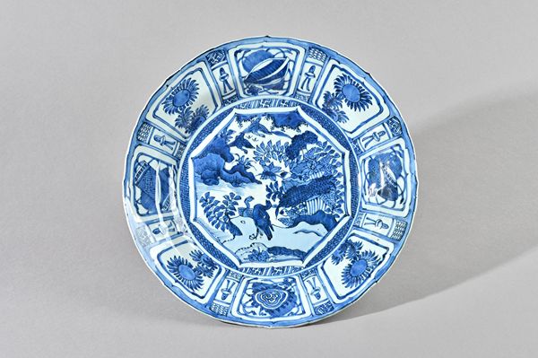 A large Chinese kraak porcelain blue and white dish, early 17th century, painted in the centre with ducks by a pond, inside a panelled border enclosin