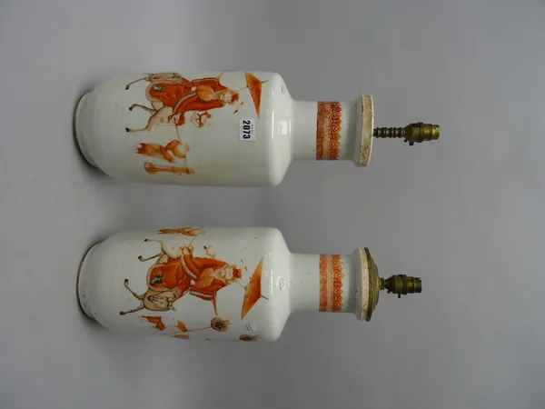 A pair of Chinese porcelain rouleau vases, 18th/19th century, painted in rouge-de-fer and black with a procession depicting an official on horseback w