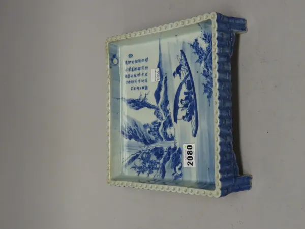 An unusual Chinese blue and white square stand, probably Republican, painted with four figures in a boat sailing down a river, the opposite bank with