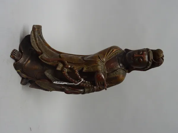 A Chinese lacquered and gilt wood figure of Guanyin, probably 19th century, carved standing in long robes, 43.5cm. high.