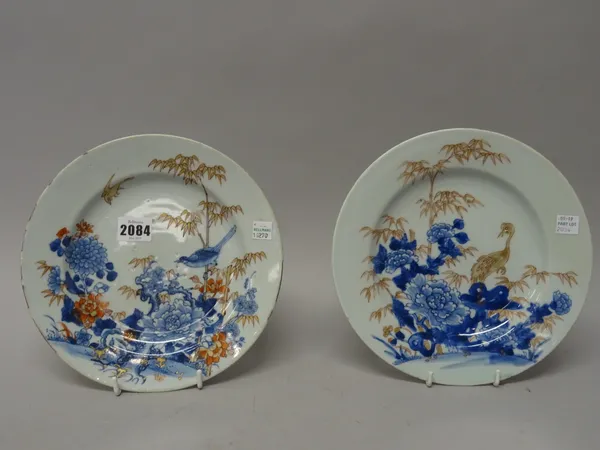 Two Chinese export plates, Qianlong,  painted in underglaze-blue, iron-red and gilding with birds amongst rocks, flowers and bamboo, 23cm.diameter, (2