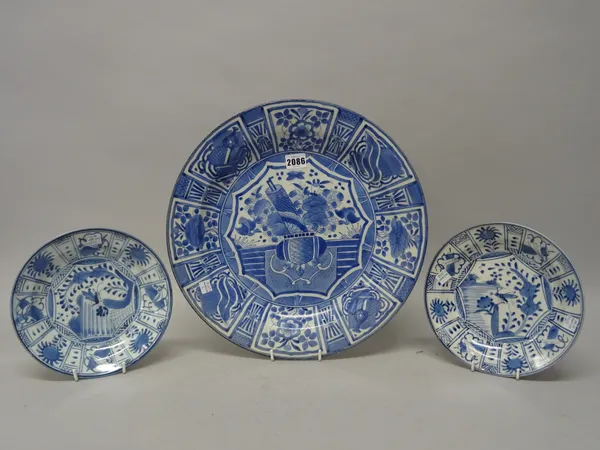 A Japanese  blue and white dish in kraak porcelain style, probably 19th century, painted in the centre with a vase, a scroll, fruit and flowers, insid