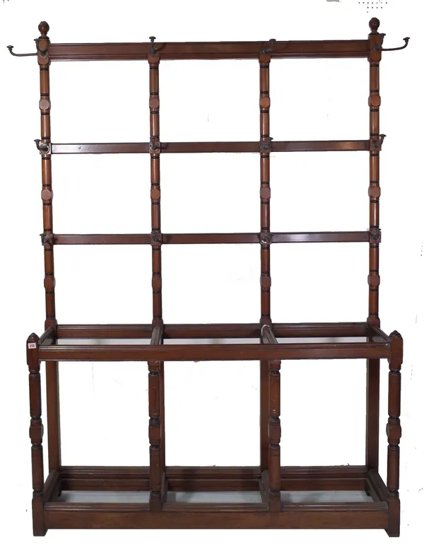 Gillows & Co; a Victorian mahogany and ebonised hall stand, with ring turned uprights and three divisions, stamped 'GILLOWS & CO. 10878', 216cm high,