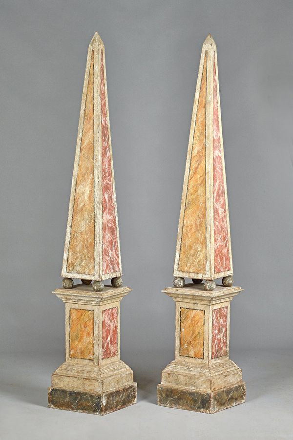 A pair of late 19th century faux marble painted obelisks on stands, each of tapering form on ball supports and rectangular base, 198cm high. (2) Prove