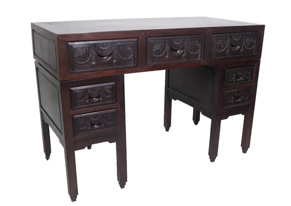 A late 19th century Chinese hardwood pedestal desk, with seven drawers about the knee, 115cm wide x 79cm high x 55cm deep. Provenance; property from t