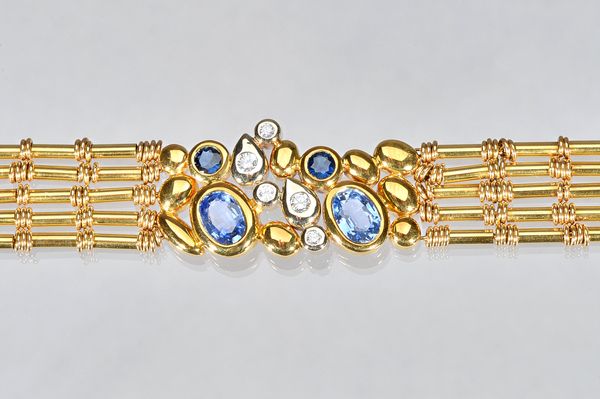 An Italian gold, sapphire and diamond bracelet, the centre collet set with two oval cut sapphires, two circular cut sapphires and with five circular c