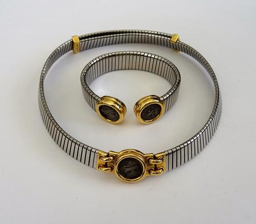 A Bvlgari gold and steel collar necklace, the front mounted with an ancient coin, detailed to the back of the setting Lokris-Opontii 4th Cent. B.C. an
