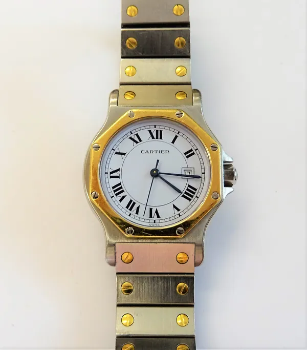 A Cartier steel and gold lady's bracelet wristwatch, the signed white dial with black Roman numerals, date of the month aperture and with centre secon