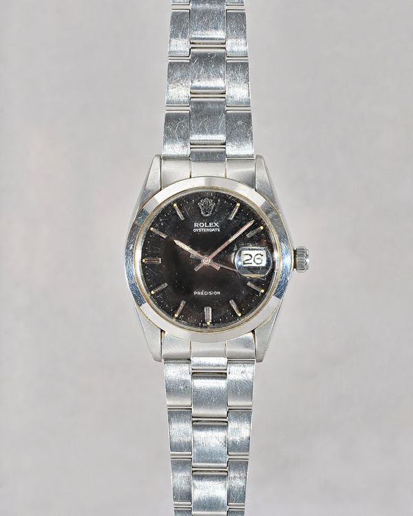 A Rolex Oysterdate Precision steel gentleman's bracelet wristwatch, the signed black dial with baton numerals, Rolex crown at 12 o'clock, centre secon