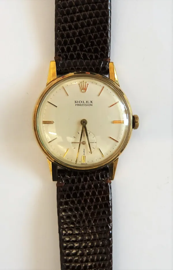 A Rolex Precision 9ct gold circular cased gentleman's wristwatch, with a signed jewelled movement, the signed silvered dial with gilt baton numerals,