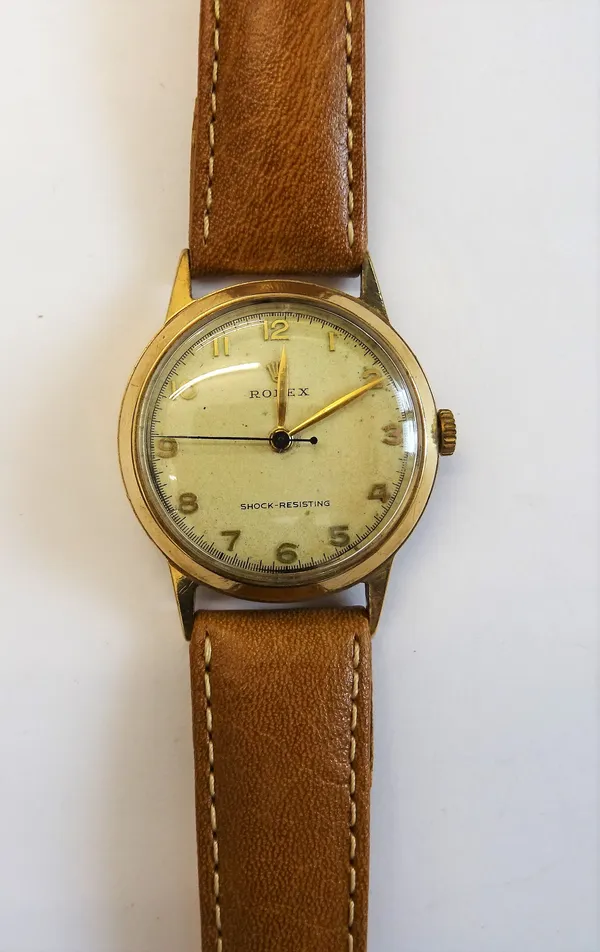 A Rolex 9ct gold circular cased three quarter size wristwatch, with a signed jewelled movement numbered 69426, the signed dial with gilt hands, blued