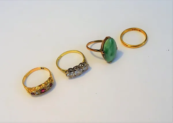 A 22ct gold wedding ring London 1941, 2.5gms, an 18ct gold ruby and diamond five stone ring Birmingham 1911, a gold ring mounted with an oval jade det