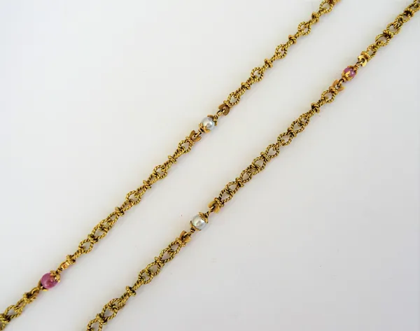 A gold, cultured pearl and ruby bead necklace, in a multiple ropetwist link design, spaced with cultured pearls and ruby beads at intervals, on a bolt