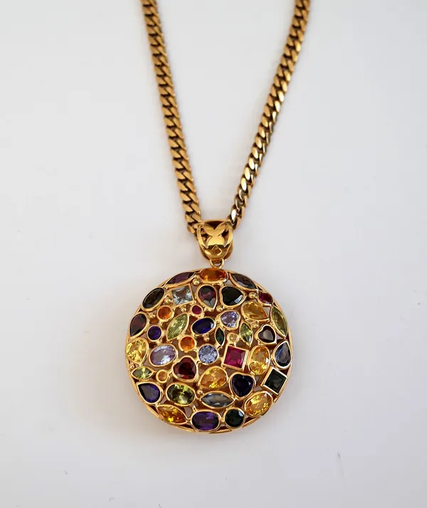 A gold and varicoloured gemstone set pendant, of circular abstract form, mounted with variously cut coloured gemstones, including garnet, peridot and