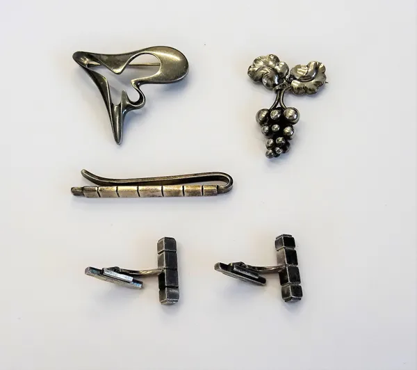 A group of Georg Jensen silver jewellery, comprising; a brooch in an abstract design, detailed Georg Jensen Sterling Denmark 324, a brooch with a pend