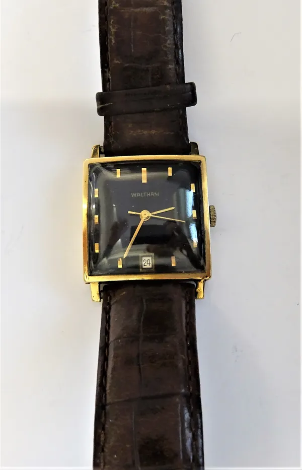 A Waltham 9ct gold square cased gentleman's automatic wristwatch, with a jewelled movement, the signed square black dial with gilt baton numerals, gil