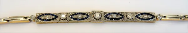 A gold diamond and blue gem set bracelet, the front collet set with the five principal cushion shaped diamonds graduating in size to the centre, other