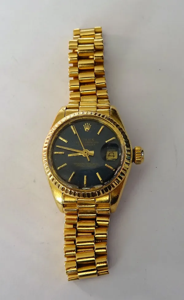 A Rolex Oyster Perpetual Datejust lady's 18ct gold bracelet wristwatch, the signed blue dial with gilt baton numerals, gilt hands, centre seconds and