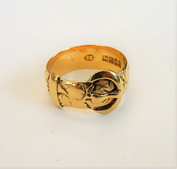 An 18ct gold ring, in a buckle and strap design, London 1919, ring size N and a half, weight 6.1 gms, with a case.