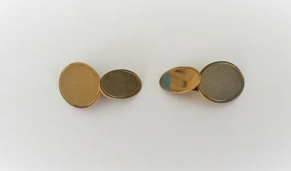 A pair of 9ct gold cufflinks, the larger oval fronts with engine turned decoration, the smaller oval backs undecorated, Birmingham 1978, weight 7.4 gm