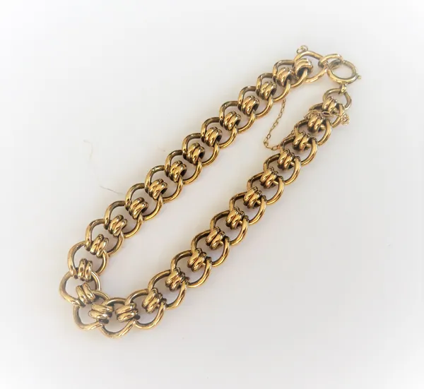 A 9ct gold bracelet, in an interlooped link design on a boltring clasp with a safety chain, 28.1gms.