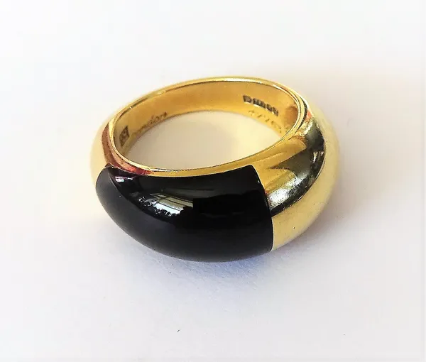 A Cartier 18ct gold and black onyx ring, in a raised bombe design, detailed Cartier London 47763, London 1988, gross weight 6.4 gms, ring size G and a