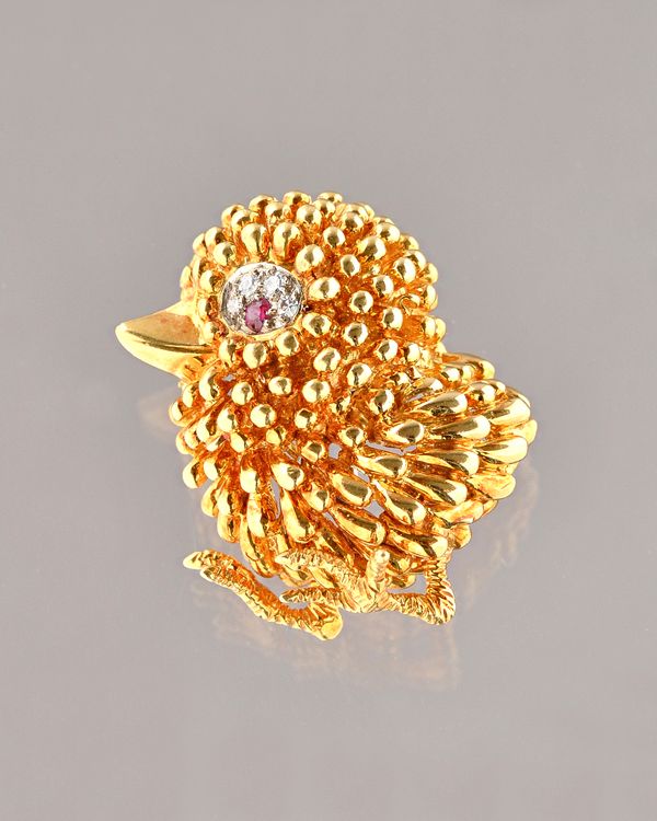 A Kutchinsky 18ct gold, ruby and diamond brooch, designed as a chick, the eye mounted with a circular cut ruby and with four circular cut diamonds, pr