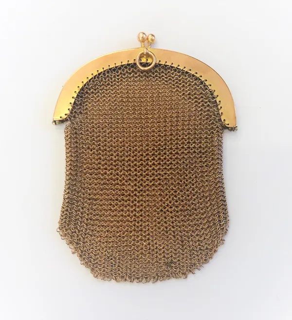 A lady's gold chain mesh purse, the semi-circular undecorated mounts detailed 9ct, on a snap clasp, fitted with a suspension ring, weight, 38.8 gms.