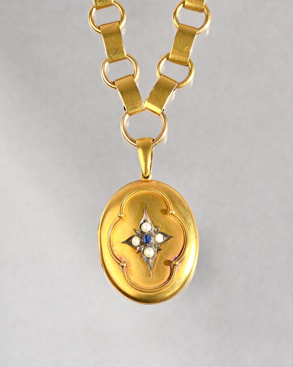 A Victorian gold, sapphire and half pearl set oval pendant locket, glazed with a photographic locket compartment within, the front with a sapphire and