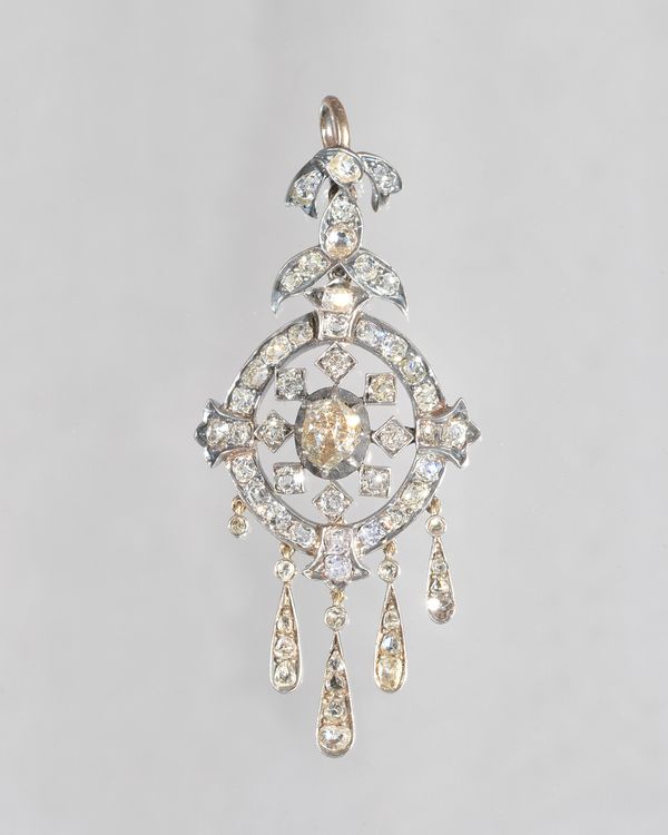 A pair of Victorian diamond pendant earrings, each mounted with the principal oval cut diamond at the centre, in an openwork surround set with cushion