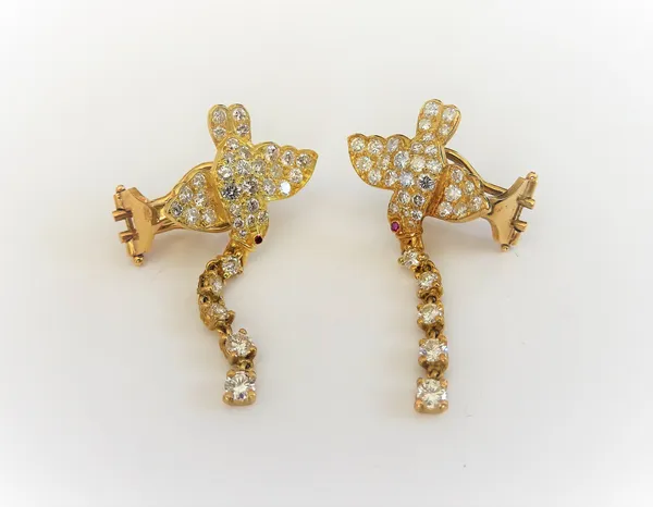 A pair of 18ct gold and diamond earclips, each designed as a bird in flight, mounted with circular cut diamonds and with a row of five graduated circu