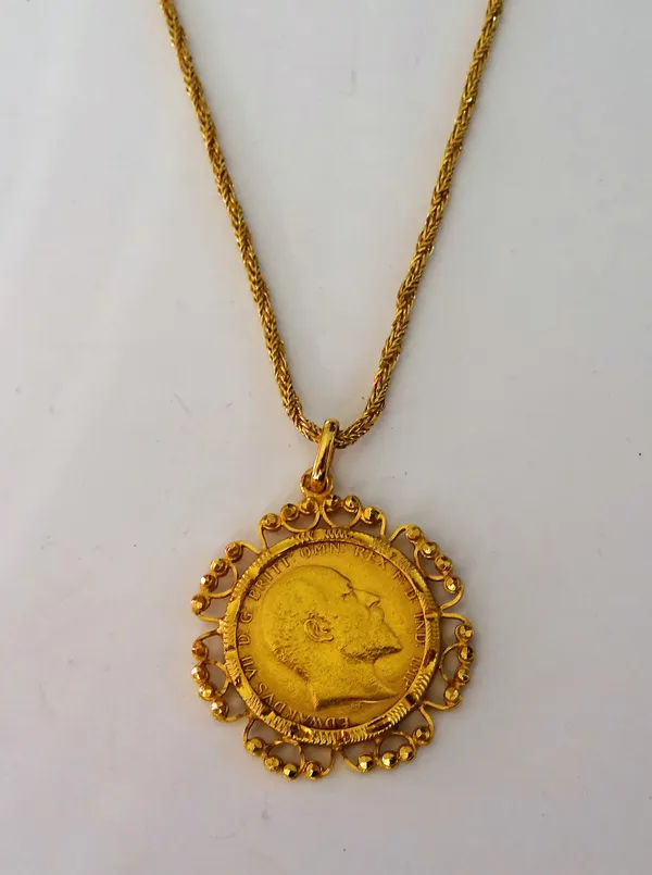 An Edward VII sovereign 1907, in a gold pendant mount, of Middle Eastern design, with a Middle Eastern gold multiple link neckchain, on a boltring cla