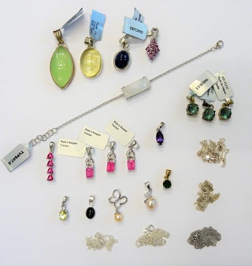 A group of mostly silver jewellery, comprising; five neckchains, one bracelet and seventeen gem set pendants in a variety of designs, (23).