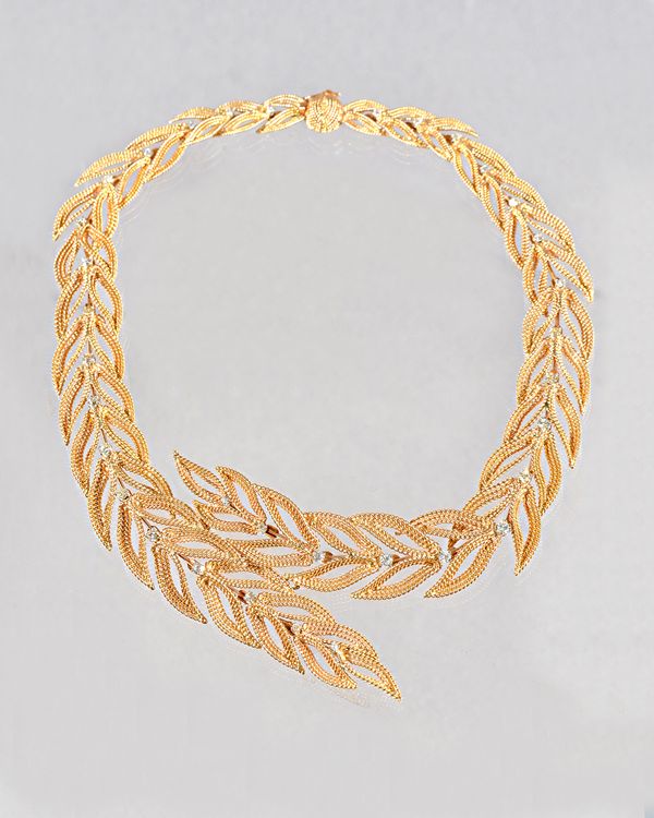 A French gold and diamond set collar necklace, in a graduated overlapping open work foliate design, of rope twist wire work form, claw set with circul