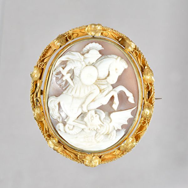 A Victorian oval shell cameo brooch, carved as St George slaying the dragon, within a foliate and wirework surround, the back glazed with a portrait m