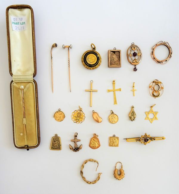 A Victorian black enamelled circular pendant mourning locket, seventeen further mostly gold pendants and charms, a stick pin mounted with a cultured p