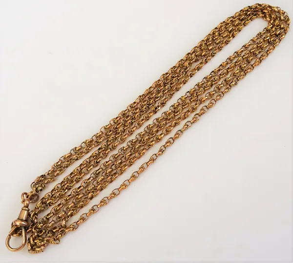 A gold multiple link long guard chain, the front fitted with a swivel, detailed 9 CT, weight 18.5 gms.