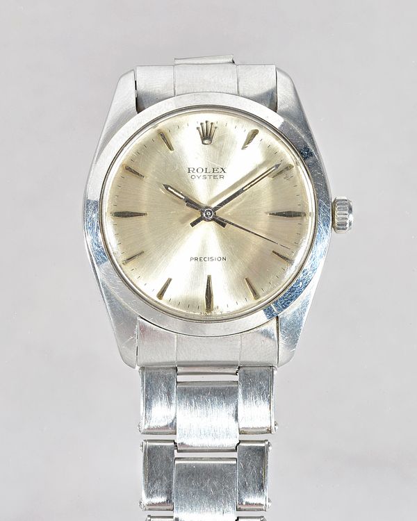 A Rolex Oyster Precision gentleman's steel cased wristwatch, the signed silvered dial with baton shaped numerals, Rolex crown at 12 o'clock and with c