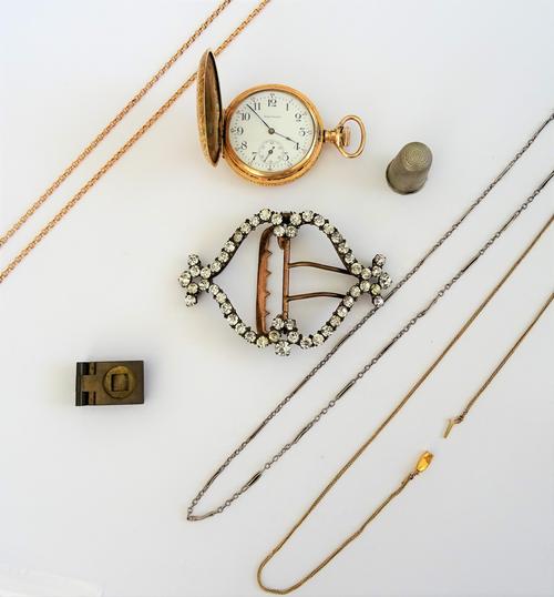 A gold oval link neckchain, on a boltring clasp, a gold woven link neckchain, detailed 9 CT, another neckchain, a thimble, a brass mounted folding mag