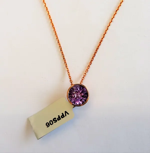 A Glenn Lehrer gold and quasar cut amethyst single stone pendant, detailed 10K, with a 9ct gold oval link neckchain on a sprung hook shaped clasp, det