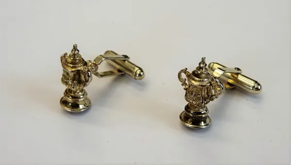 A pair of silver cufflinks, the fronts designed as The FA Cup and with folding sprung bar fittings at the backs, combined gross weight 11 gms, by Mapp