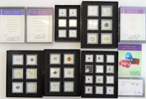 A collection of unmounted coloured gemstones displayed in eight cases, including; emerald collection, fancy cut collection, African safari collection