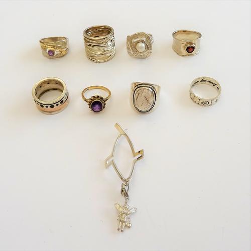A 9ct gold ring, collet set with an oval cut amethyst in a ribbon twist surround, ring size L and mostly silver jewellery, comprising; seven rings and