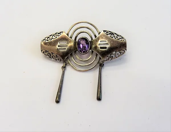 A Christian Seybold silver and amethyst single stone brooch, in an Art Deco design, mounted with the oval cut amethyst to the centre, otherwise with p