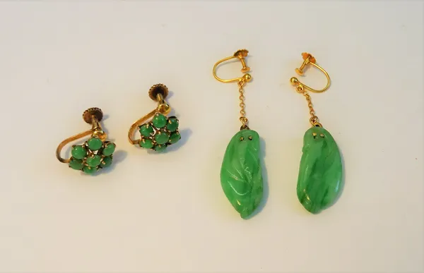 A pair of gold and green bead cluster earings, the screw fittings detailed 14ct and a pair of gold and carved jade pendant earings, the tops with scre