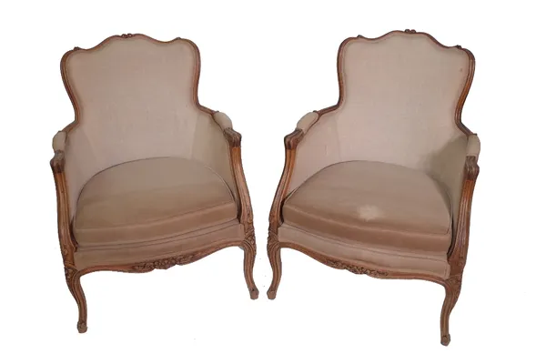 A pair of Louis XV style stained beech bergere chairs, on cabriole supports. (2)Provenance; property from the late Sir David Tang This lot has been im